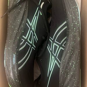 Black and Green Asics running shoes